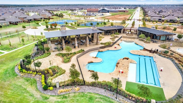 view of pool featuring a residential view and a patio area