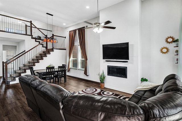 10508 Bluestone Ln, Aubrey, TX 76227 - living room with stairs, dark wood finished floors, baseboards, ceiling fan, and recessed lighting