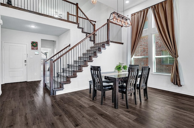 10508 Bluestone Ln, Aubrey, TX 76227 - dining room featuring a towering ceiling, baseboards, stairs, wood finished floors, and recessed lighting