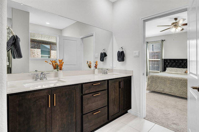 10508 Bluestone Ln, Aubrey, TX 76227 - ensuite bathroom featuring double vanity, tile patterned flooring, plenty of natural light, and ceiling fan