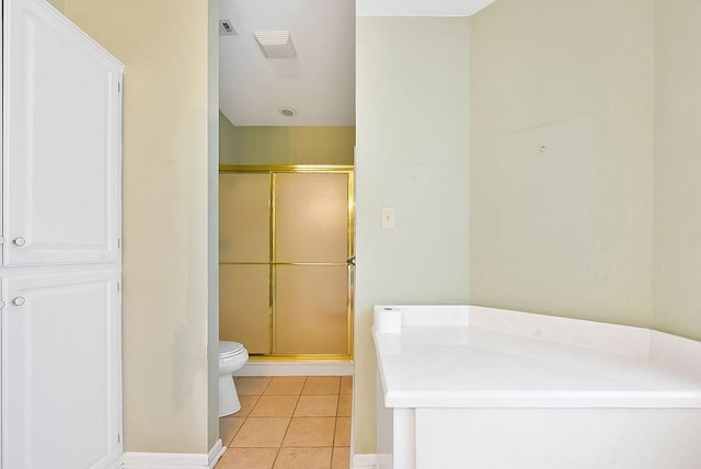 full bathroom featuring toilet, a stall shower, tile patterned flooring, and visible vents