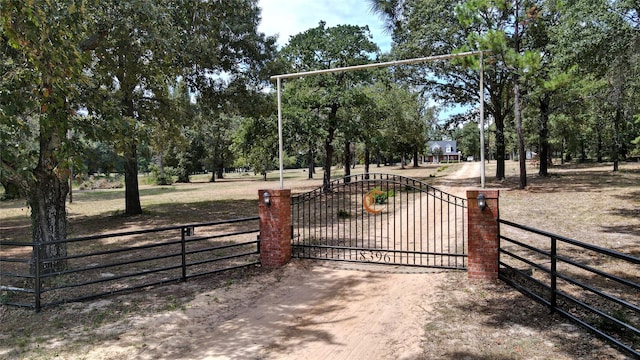 view of gate featuring fence