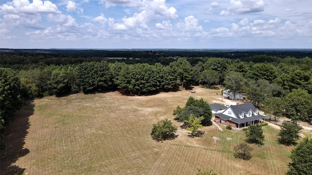 drone / aerial view featuring a rural view and a forest view