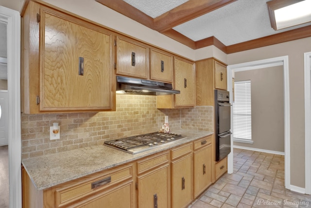 6090 Dorchester Cir, Keithville, LA 71047 - kitchen with baseboards, stainless steel gas cooktop, tasteful backsplash, under cabinet range hood, and stone tile floors