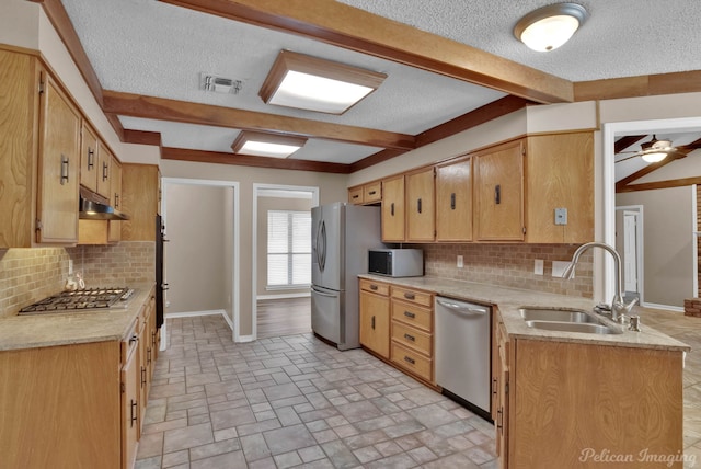 6090 Dorchester Cir, Keithville, LA 71047 - kitchen with light countertops, under cabinet range hood, a sink, beamed ceiling, and appliances with stainless steel finishes