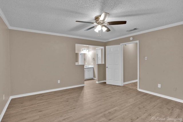 6090 Dorchester Cir, Keithville, LA 71047 - interior space featuring visible vents, crown molding, light wood-type flooring, and a textured ceiling