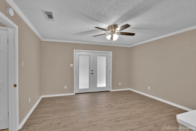 6090 Dorchester Cir, Keithville, LA 71047 - unfurnished room with crown molding, light wood-style flooring, french doors, visible vents, and a ceiling fan