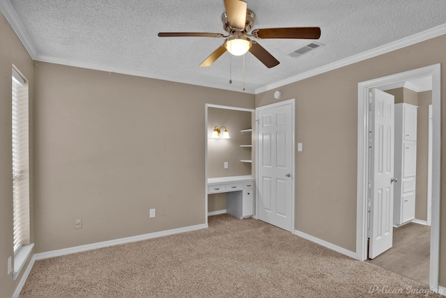6090 Dorchester Cir, Keithville, LA 71047 - unfurnished bedroom featuring a textured ceiling, ornamental molding, visible vents, and carpet