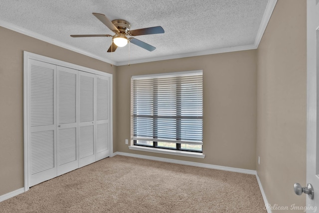 6090 Dorchester Cir, Keithville, LA 71047 - unfurnished bedroom featuring a closet, a textured ceiling, carpet, and crown molding