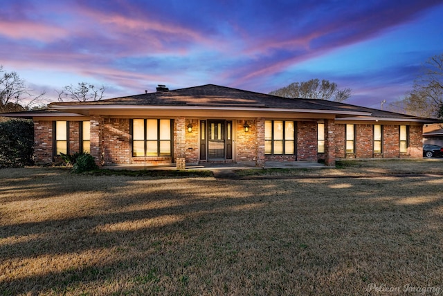 6090 Dorchester Cir, Keithville, LA 71047 - back of property featuring brick siding and a yard