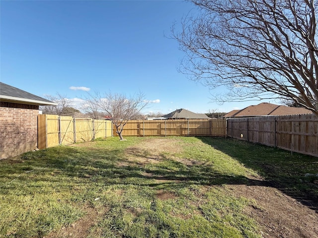 view of yard featuring a fenced backyard