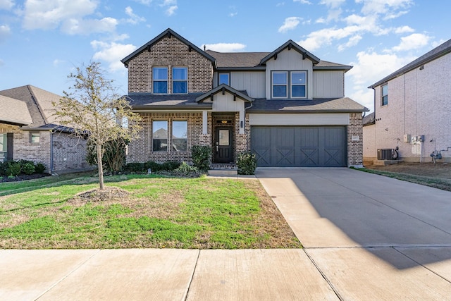 craftsman house featuring a front yard, brick siding, driveway, and an attached garage