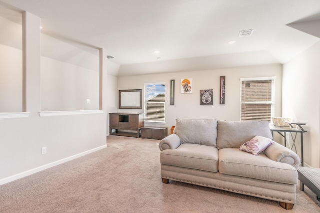 living room featuring baseboards, visible vents, lofted ceiling, carpet floors, and recessed lighting