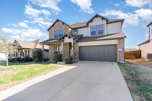 craftsman-style home featuring a garage, concrete driveway, brick siding, and board and batten siding