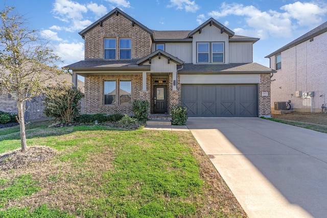 craftsman-style house featuring an attached garage, driveway, a front yard, and brick siding