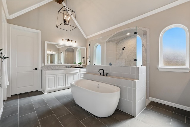 bathroom featuring crown molding, tile patterned floors, vaulted ceiling, vanity, and walk in shower