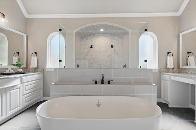 bathroom with a freestanding tub, two vanities, crown molding, and a shower stall