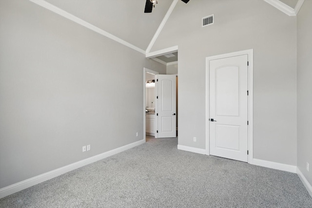 unfurnished bedroom with ornamental molding, carpet flooring, visible vents, and baseboards