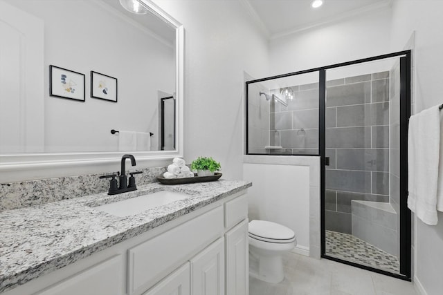 bathroom featuring toilet, a shower stall, ornamental molding, and vanity