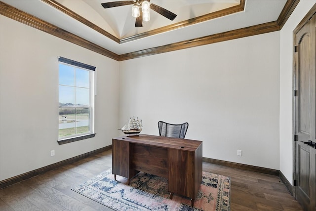 office with a tray ceiling, ornamental molding, a ceiling fan, wood finished floors, and baseboards