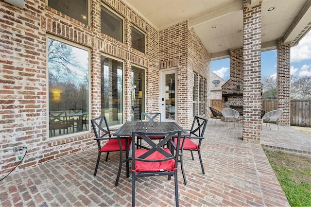 view of patio / terrace featuring fence and outdoor dining area