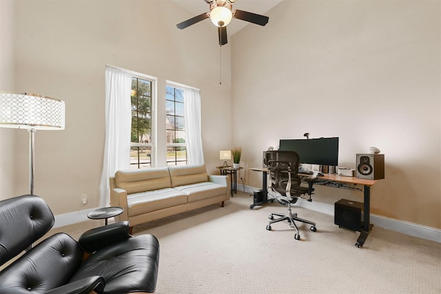 home office featuring carpet floors, high vaulted ceiling, baseboards, and a ceiling fan