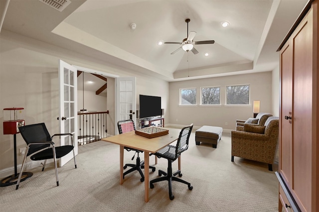 office area with light carpet, baseboards, visible vents, a raised ceiling, and french doors