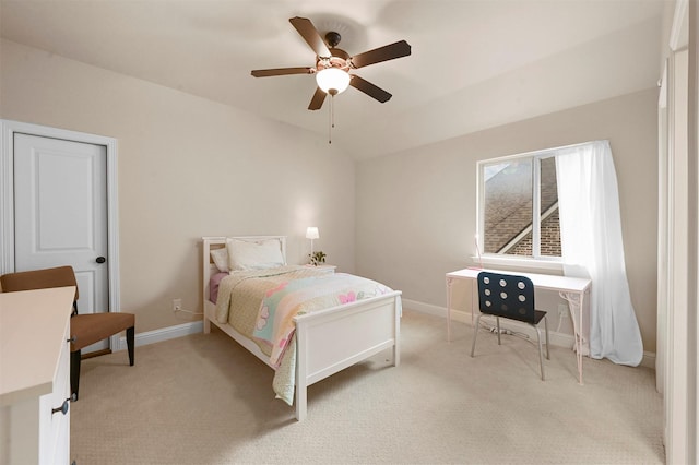 bedroom with light carpet, ceiling fan, baseboards, and lofted ceiling