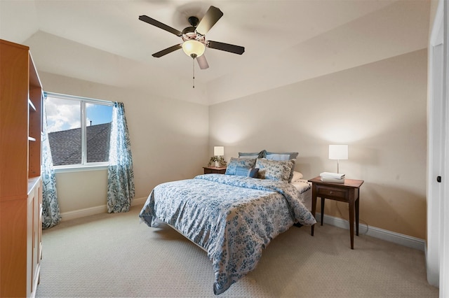 bedroom with ceiling fan, carpet floors, and baseboards