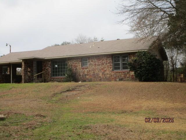 view of front of home with stone siding