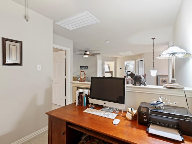 office space with ceiling fan and baseboards