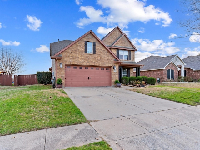 traditional-style house with driveway, a front lawn, fence, and brick siding