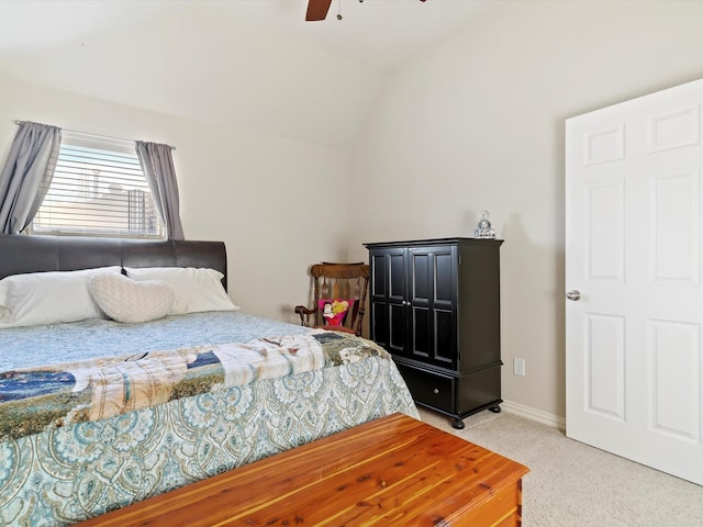 bedroom featuring lofted ceiling, ceiling fan, baseboards, and light colored carpet