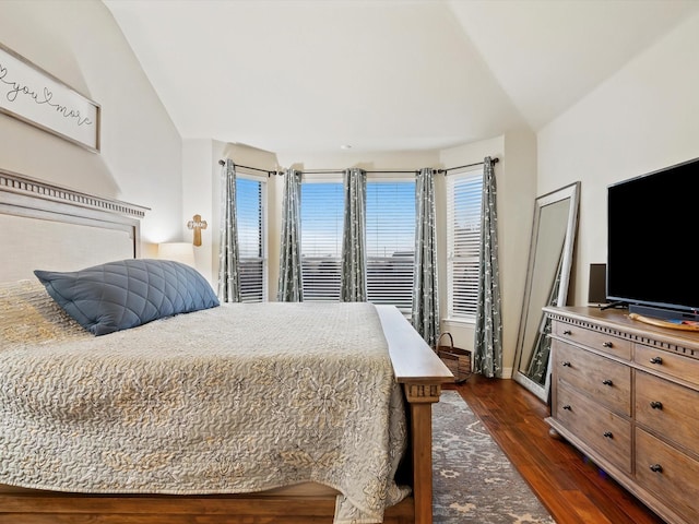 bedroom with dark wood-style floors and baseboards