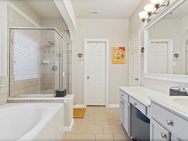 bathroom featuring a stall shower, visible vents, a garden tub, tile patterned flooring, and vanity