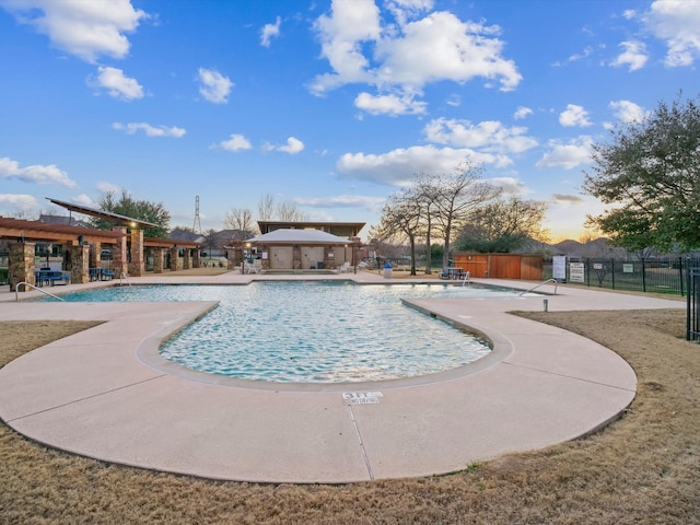 pool featuring a patio and fence