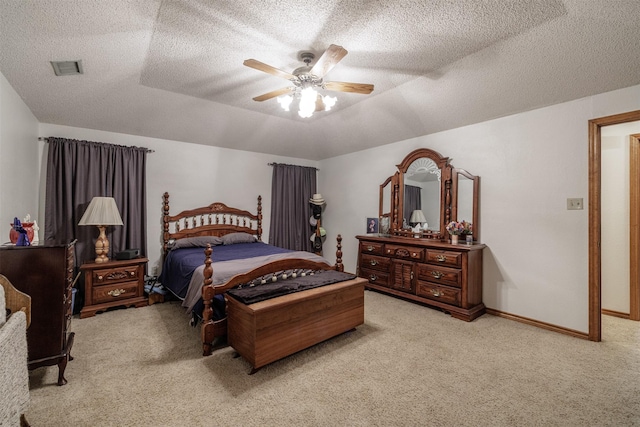 bedroom with carpet, baseboards, and a textured ceiling