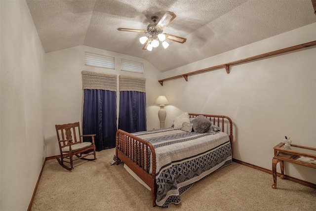 carpeted bedroom featuring vaulted ceiling, a textured ceiling, a ceiling fan, and baseboards