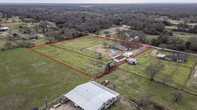 birds eye view of property featuring a rural view