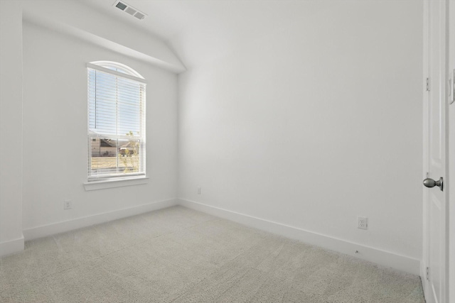 spare room featuring light carpet, baseboards, and visible vents
