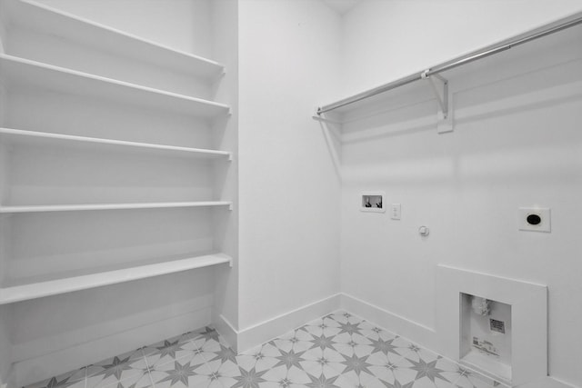 clothes washing area with hookup for a washing machine, light floors, electric dryer hookup, laundry area, and gas dryer hookup