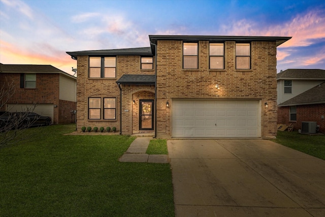 traditional home featuring an attached garage, cooling unit, brick siding, driveway, and a front lawn