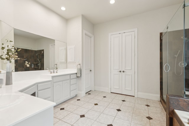 bathroom featuring recessed lighting, a stall shower, tile patterned flooring, and vanity