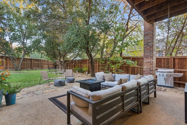 view of patio featuring a fenced backyard, a grill, and an outdoor living space