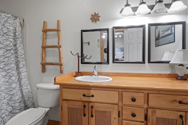 full bath with vanity and toilet