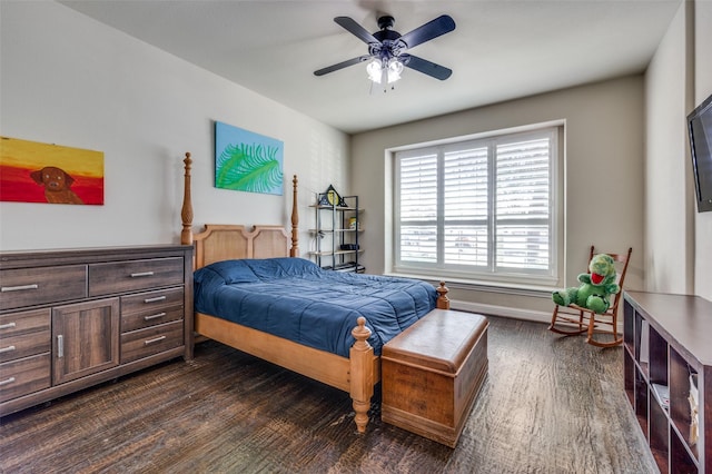 bedroom featuring ceiling fan, baseboards, and dark wood finished floors