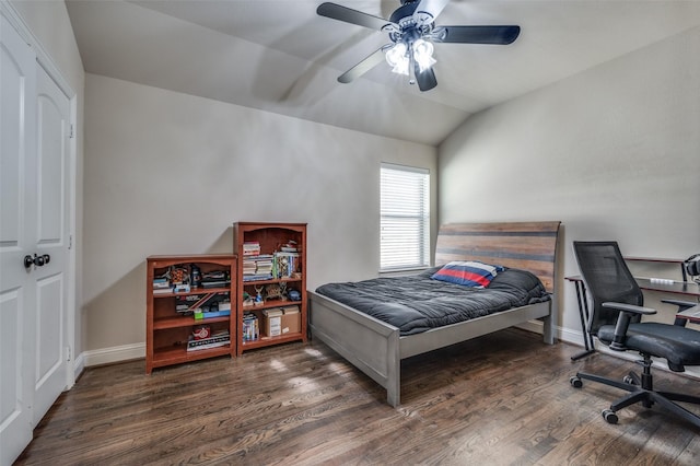 bedroom with a ceiling fan, baseboards, vaulted ceiling, and wood finished floors