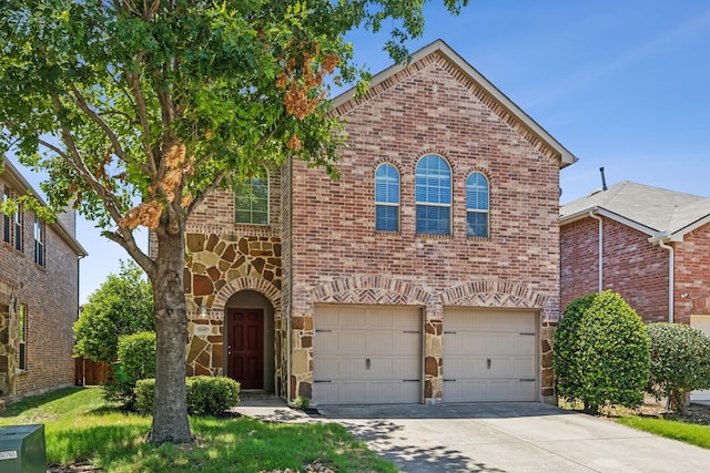 view of front of house with stone siding, brick siding, an attached garage, and driveway