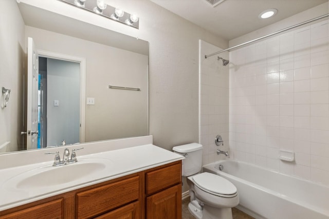 bathroom with toilet, shower / tub combination, and vanity