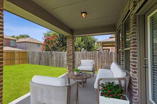 view of patio / terrace with outdoor lounge area and fence